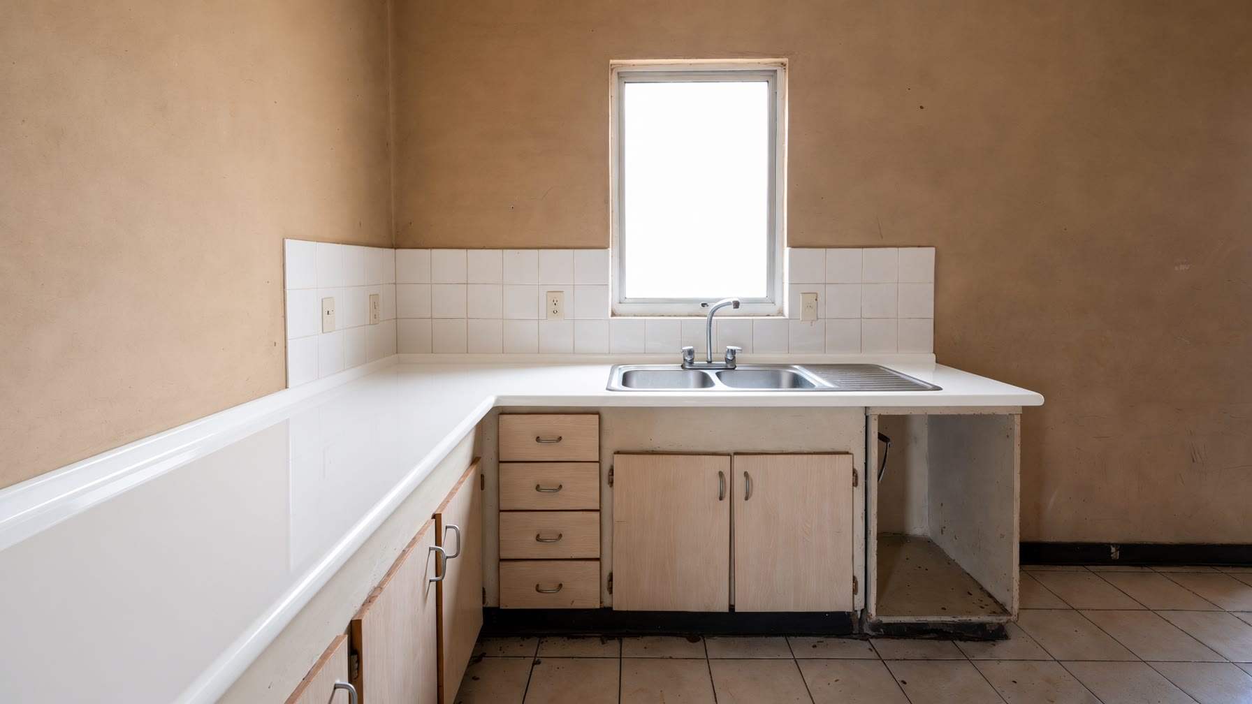 The same empty kitchen after a bright white epoxy recast wrapping the bullnose