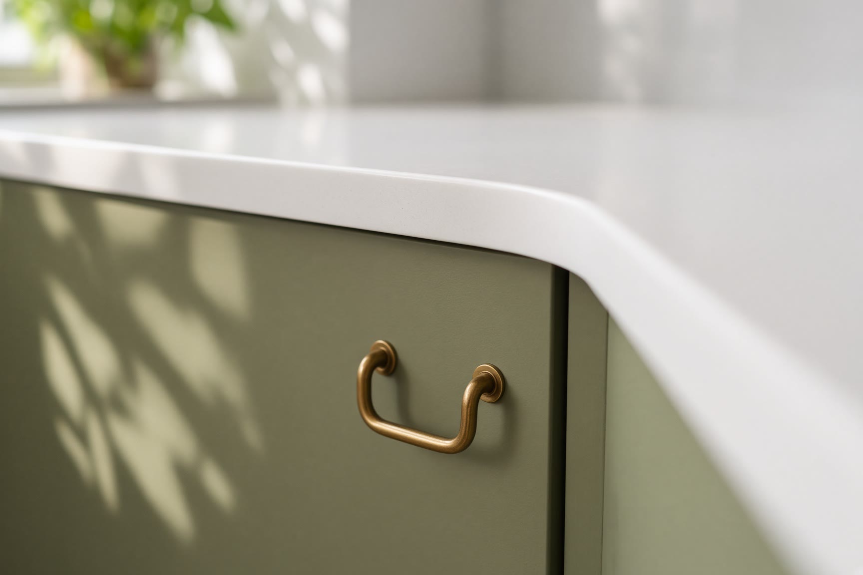 Sprayed olive cabinet and new brass handle beside a recast bench